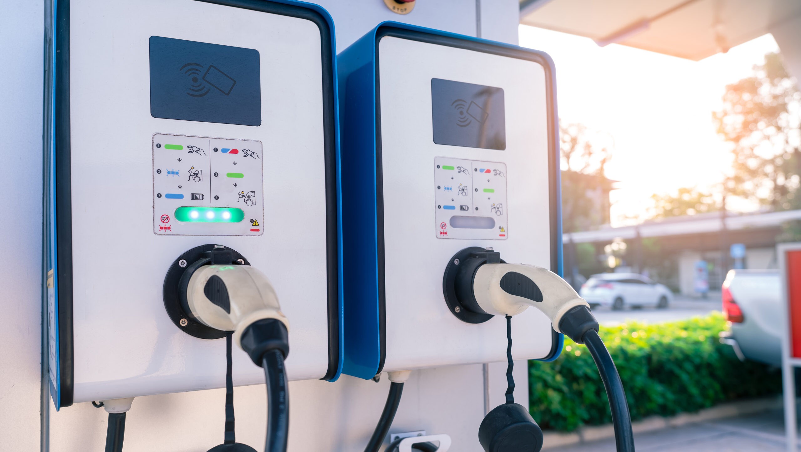 Electric car charging station for charge EV battery. Plug for vehicle with electric and hybrid engine. EV charger. Clean energy. Charging point for EV car. Green power . Future transport technology. Energy Transition.